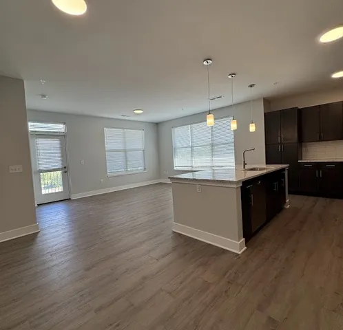 a kitchen with a sink and window