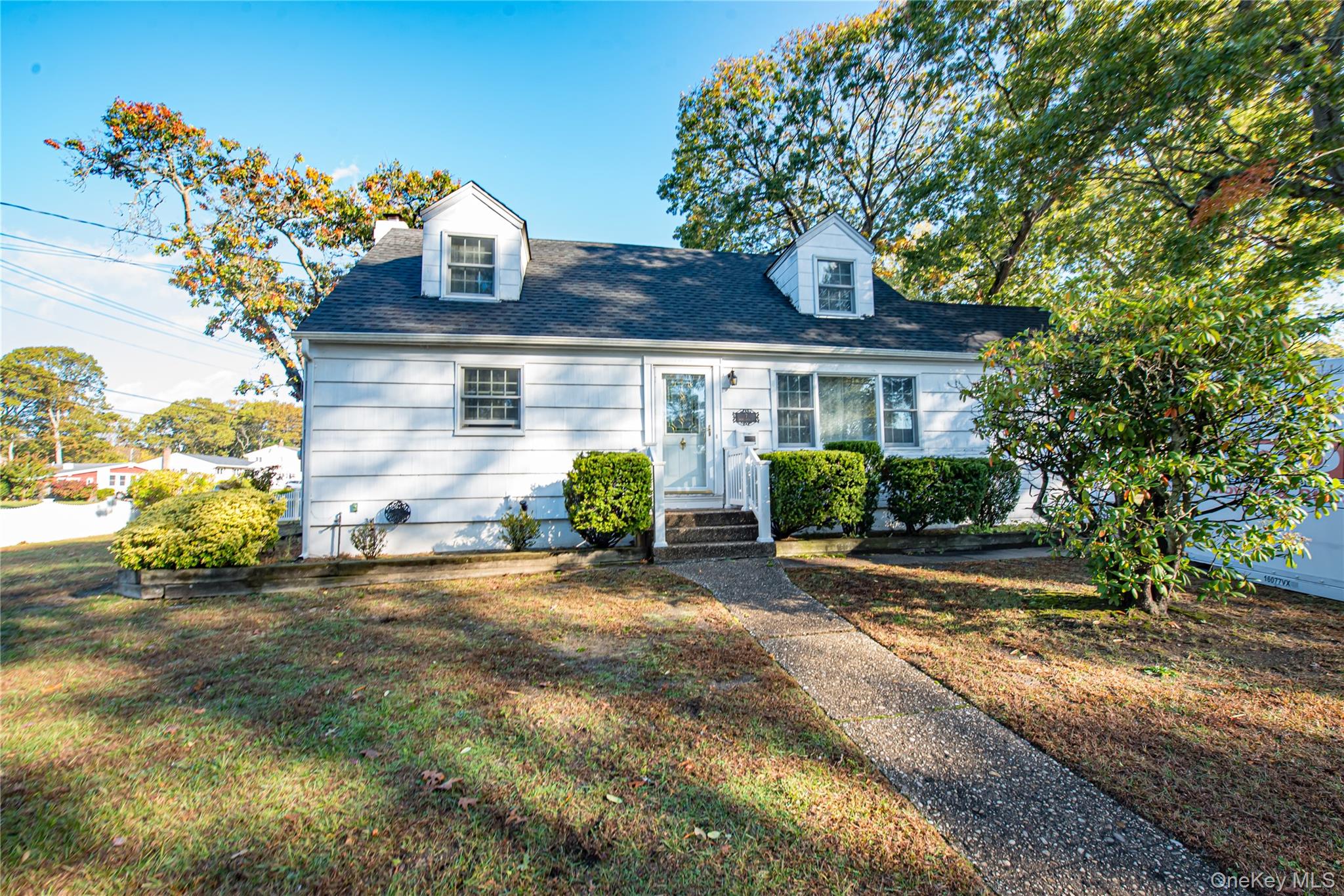 7 Babe Ruth Street Bay Shore, NY 11706 - Photo 1 of 1 Cape cod home with a front yard and a shingled roof