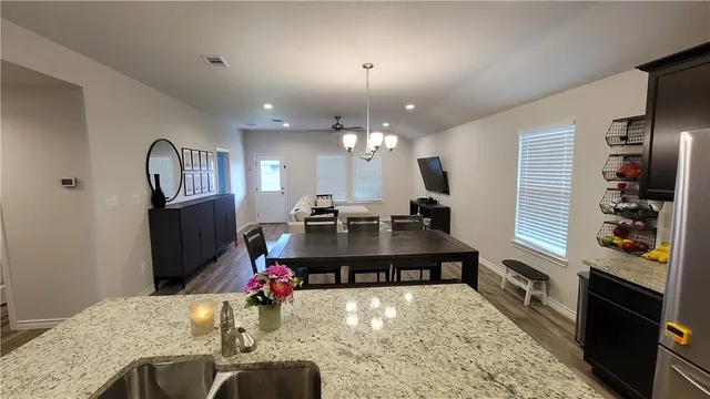 a view of a living room and dining room
