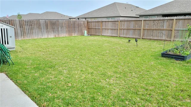 a view of a backyard with a garden