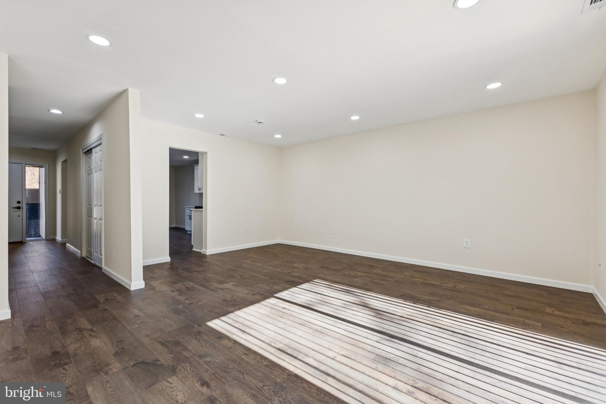 2015 Wethersfield Court Reston, VA 20191 - Photo 10 of 24 an empty room with wooden floor and natural light