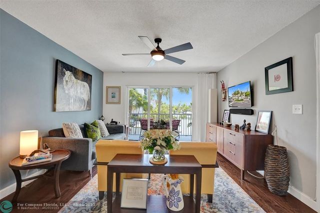 a kitchen with a sink appliances and cabinets