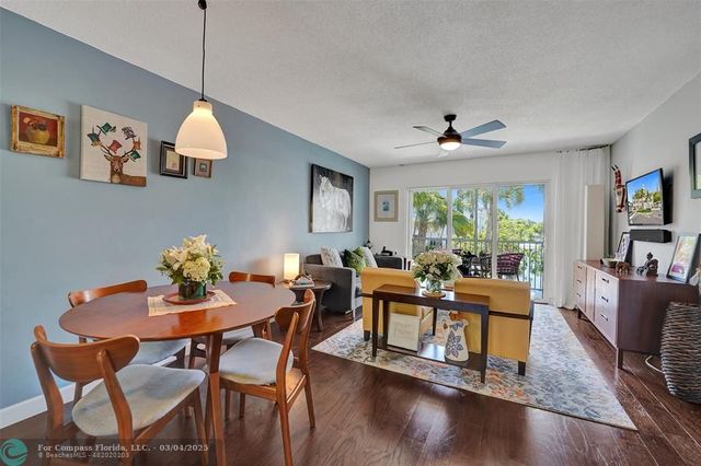 a view of city from balcony with seating area