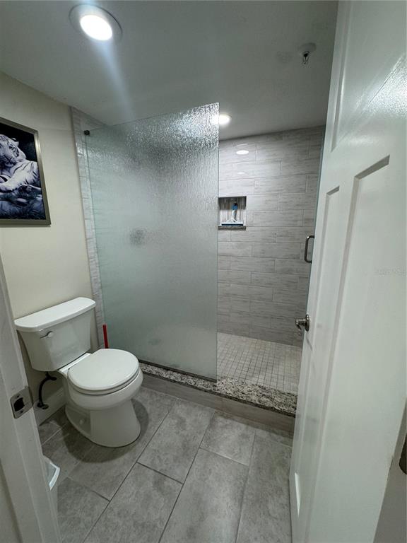15000 Gulf Boulevard, Unit 1108 Madeira Beach, FL 33708 - Photo 15 of 20 a bathroom with a toilet and a shower