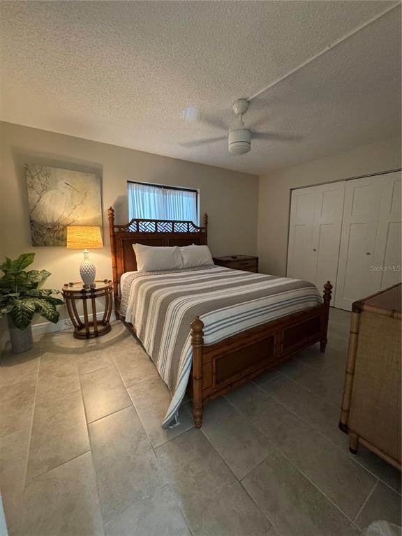 15000 Gulf Boulevard, Unit 1108 Madeira Beach, FL 33708 - Photo 17 of 20 a bedroom with a bed and wooden floor