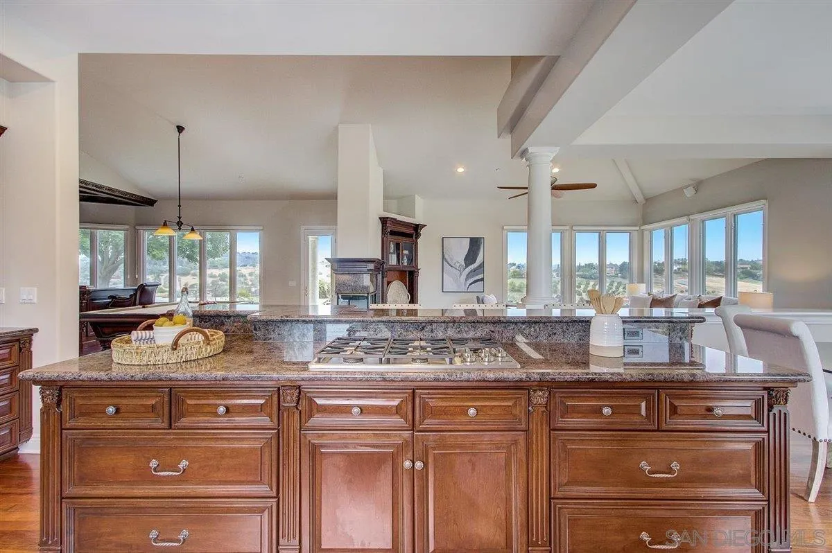 4349 Fallsbrae Road Fallbrook, CA 92028 - Photo 16 of 68 a kitchen with granite countertop a sink and cabinets