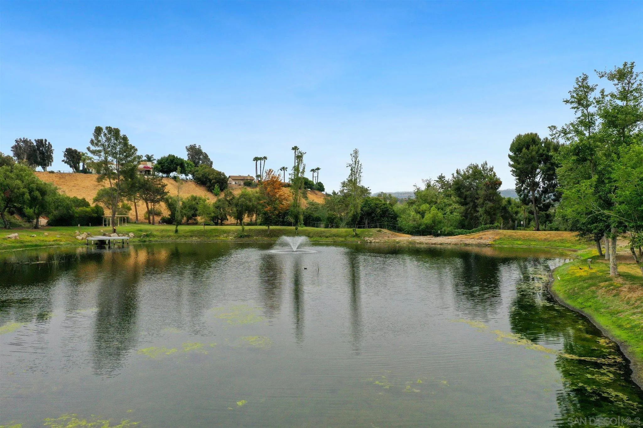 4349 Fallsbrae Road Fallbrook, CA 92028 - Photo 56 of 68 a view of a lake with houses in the back