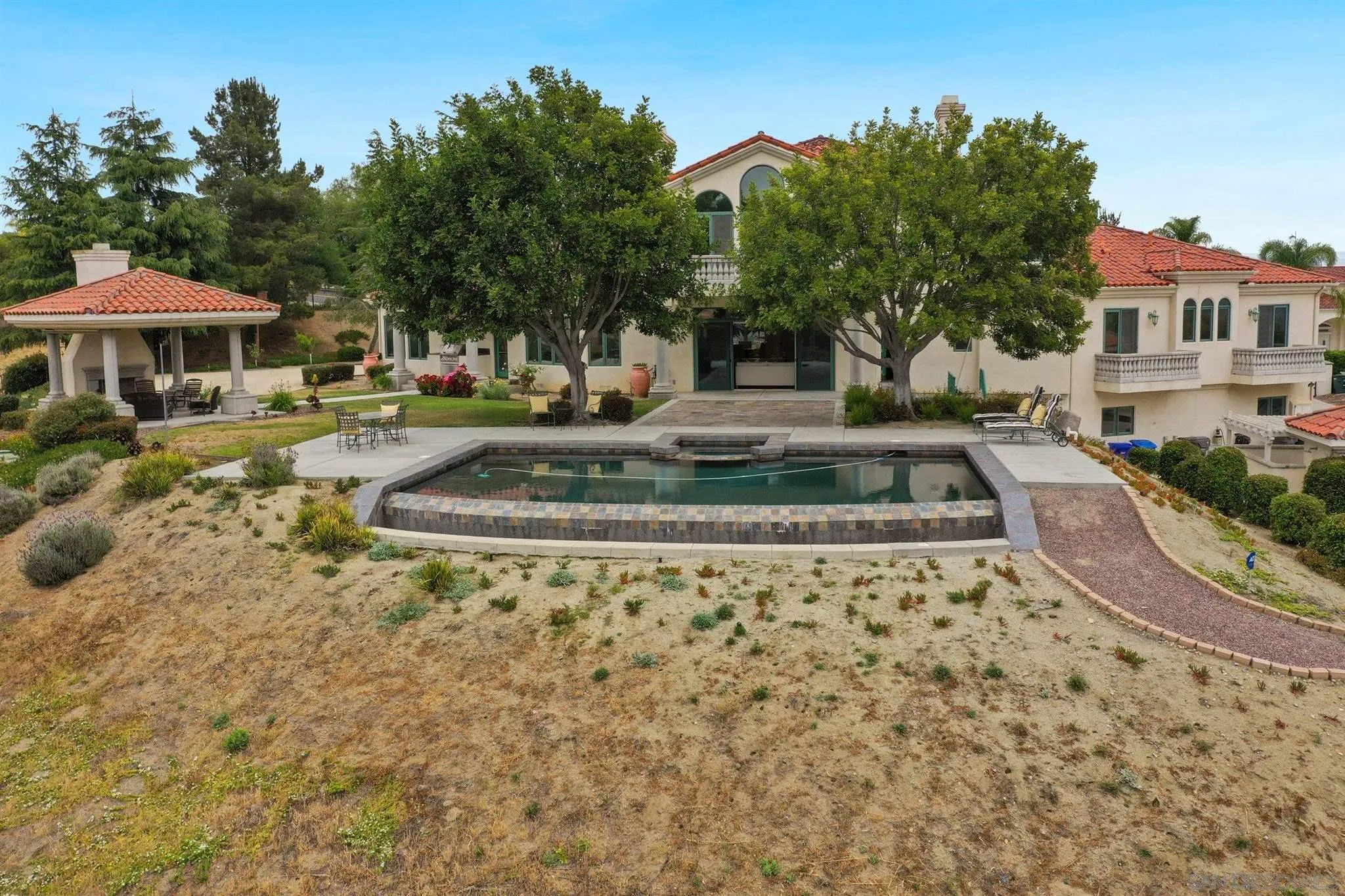 4349 Fallsbrae Road Fallbrook, CA 92028 - Photo 68 of 68 a view of a water fountain in front of a house