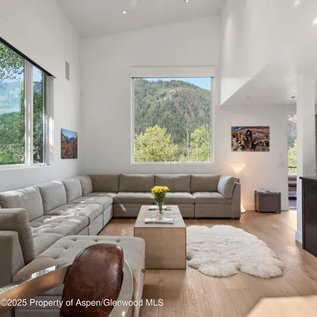 a living room with furniture and a window