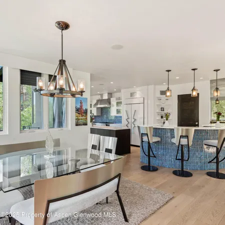 a kitchen with stainless steel appliances a sink stove and refrigerator