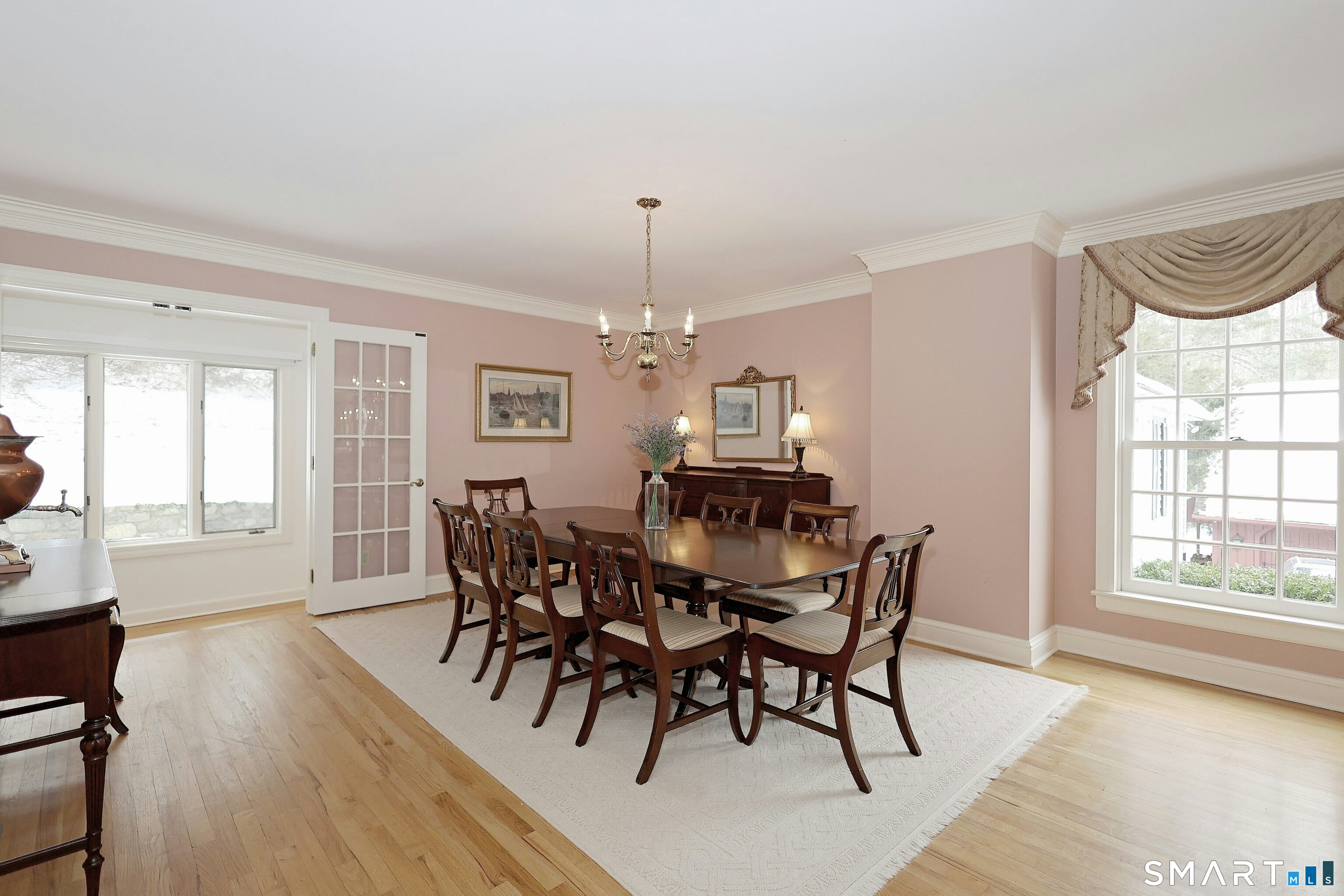 36-40 Fox Run Road Redding, CT 06896 - Photo 13 of 40 a view of a dining room with furniture window and wooden floor