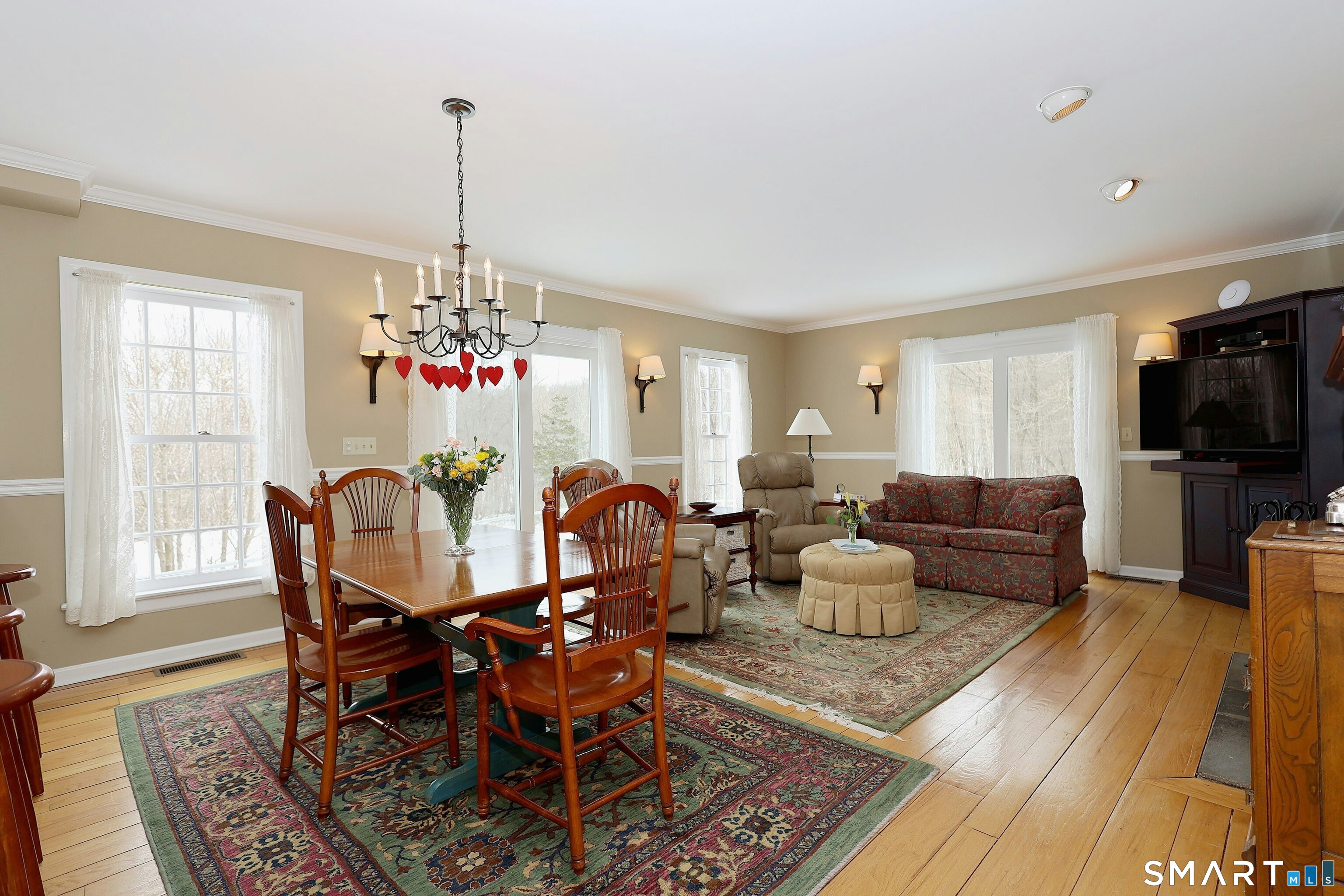 36-40 Fox Run Road Redding, CT 06896 - Photo 18 of 40 a living room with furniture a flat screen tv and a dining table