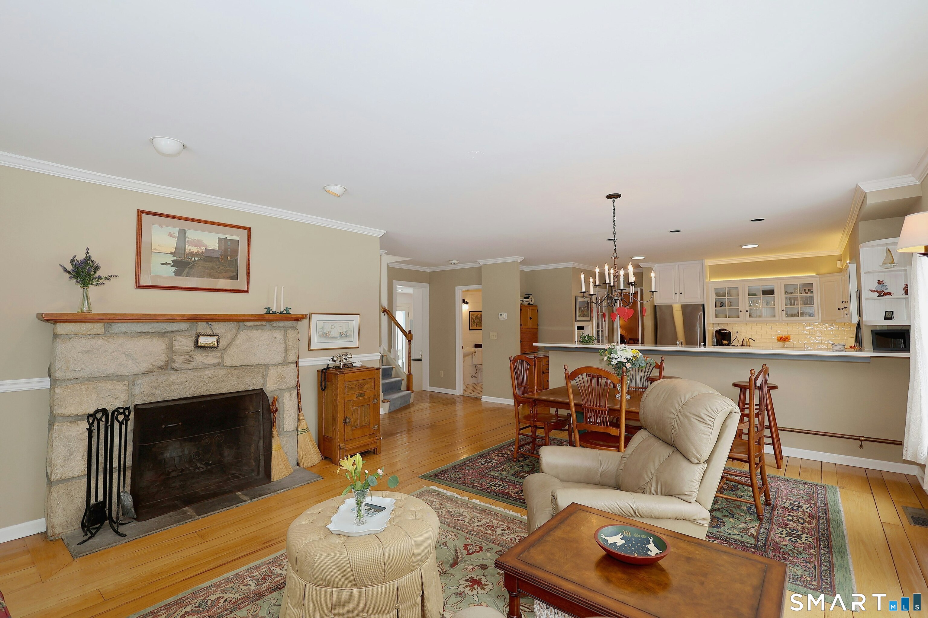 36-40 Fox Run Road Redding, CT 06896 - Photo 19 of 40 a living room with furniture and a fireplace