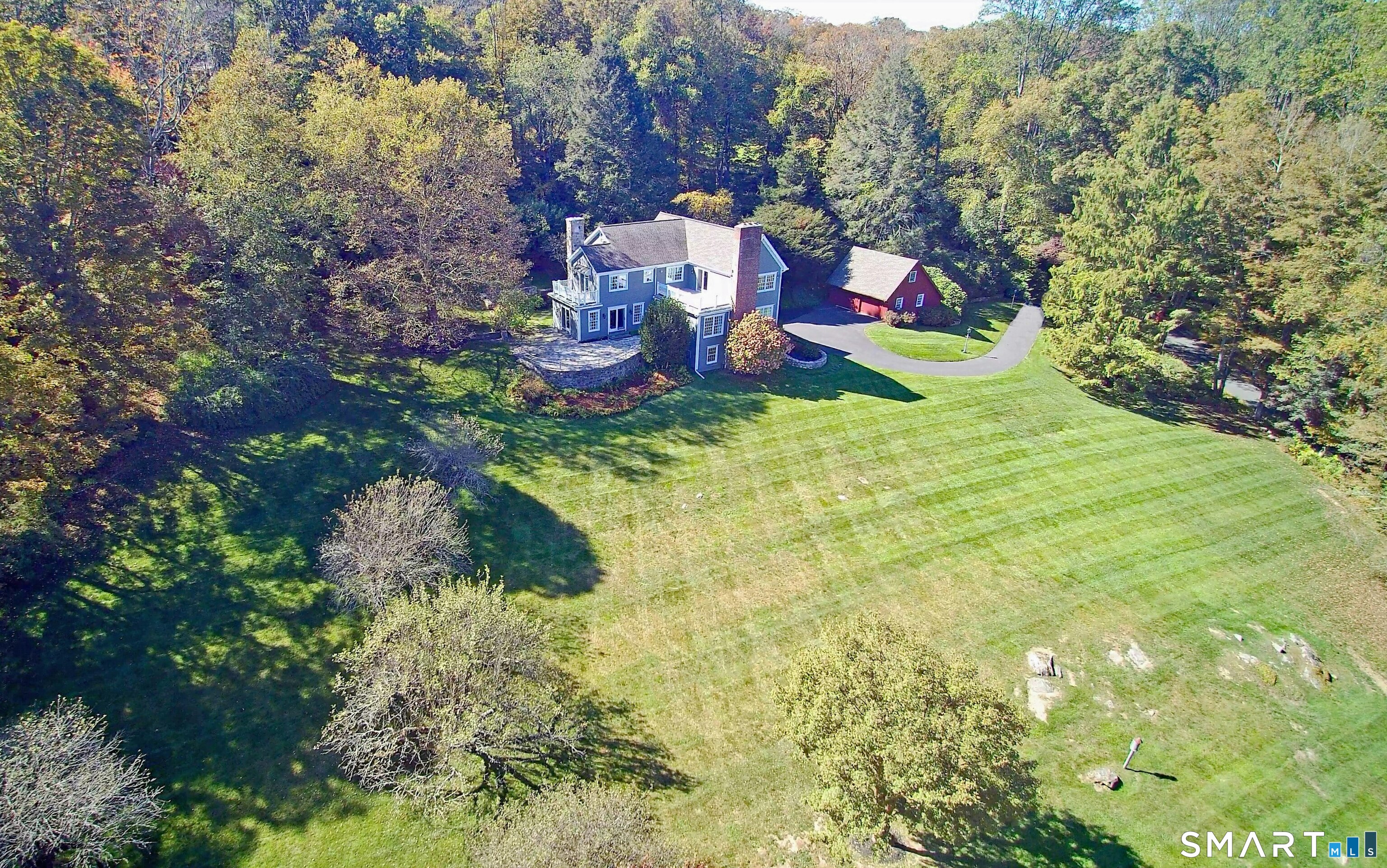 36-40 Fox Run Road Redding, CT 06896 - Photo 2 of 40 a view of a house with a yard and sitting area