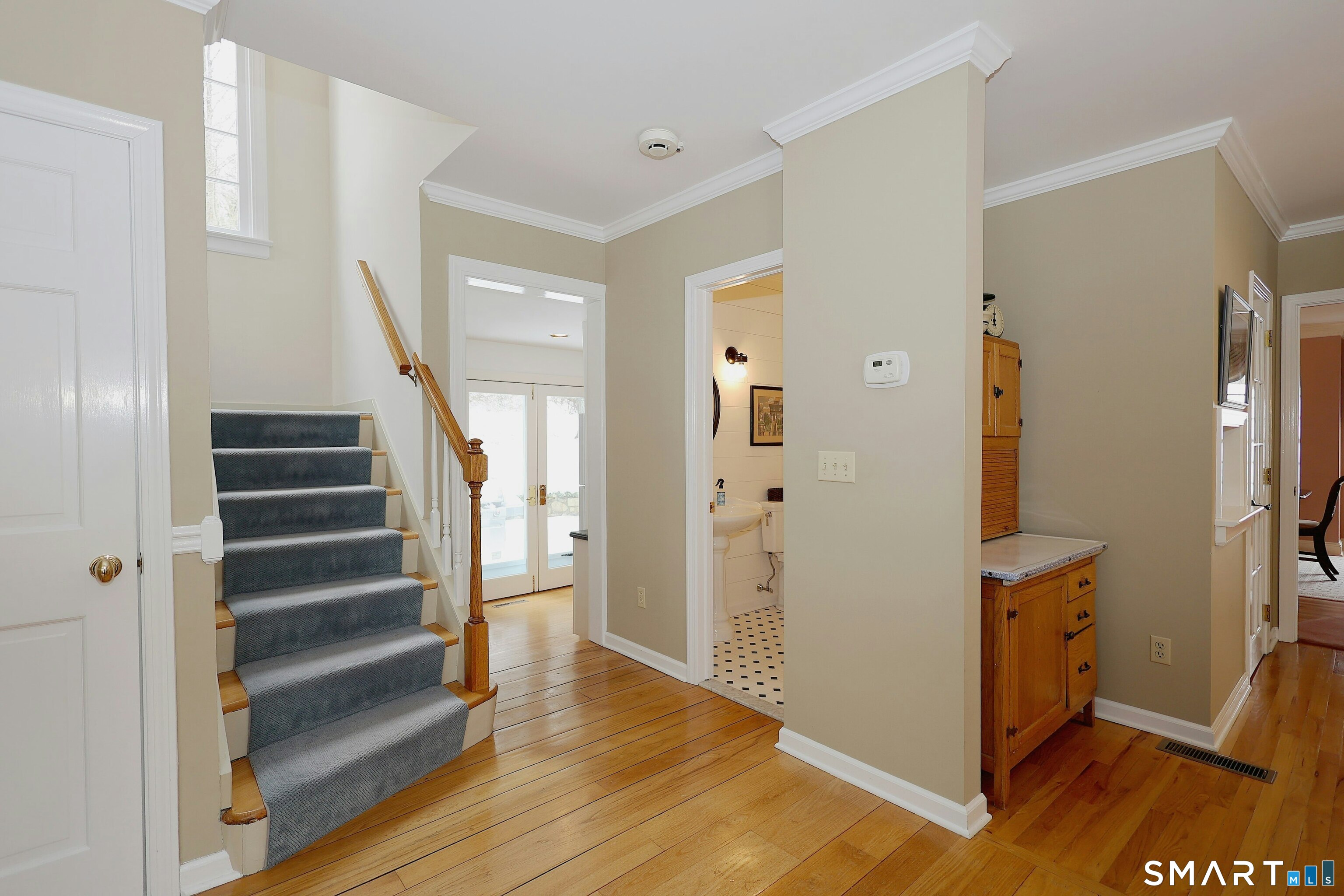 36-40 Fox Run Road Redding, CT 06896 - Photo 21 of 40 a view of a hallway with wooden floor and entryway