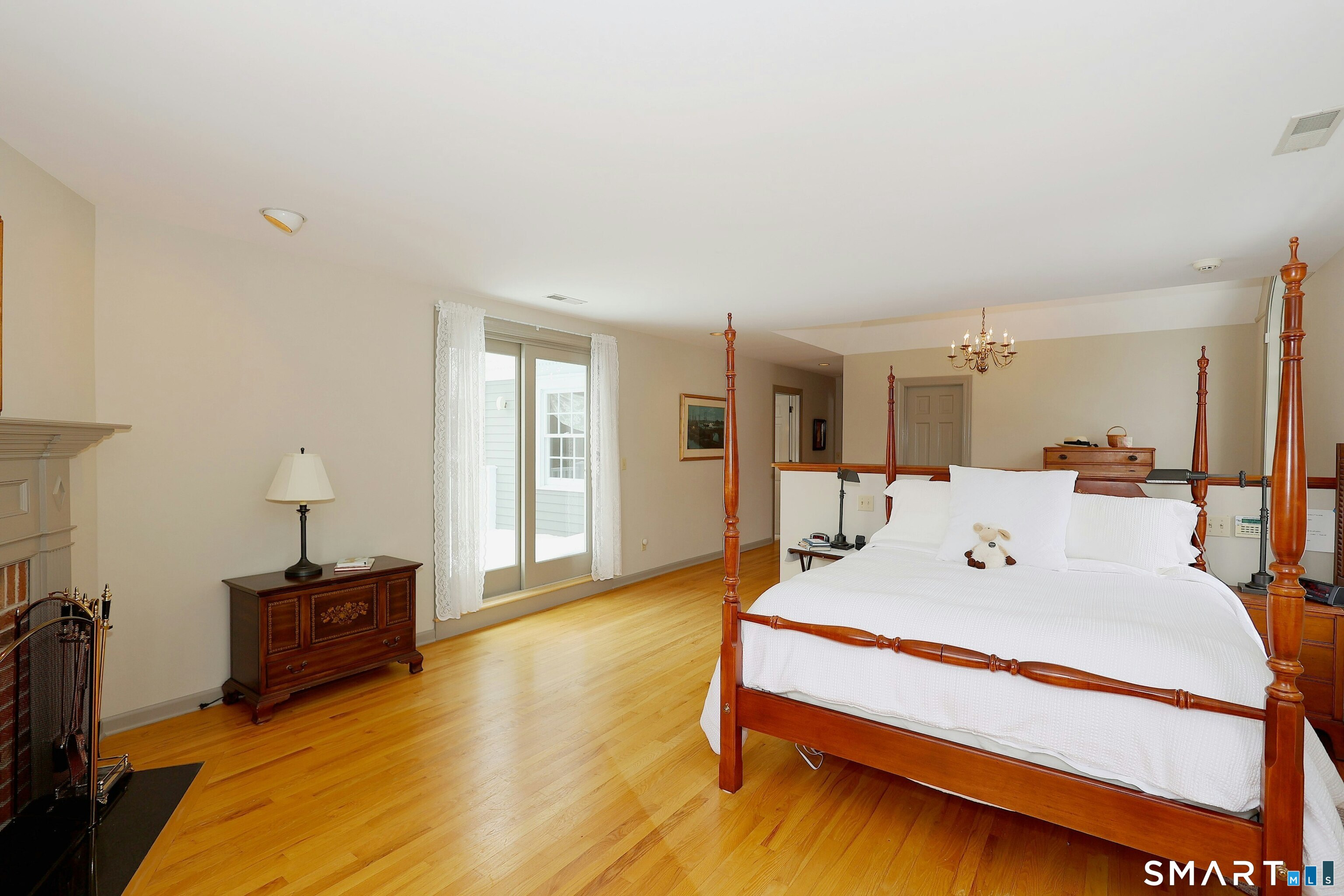36-40 Fox Run Road Redding, CT 06896 - Photo 24 of 40 a large bedroom with a bed and wooden floor