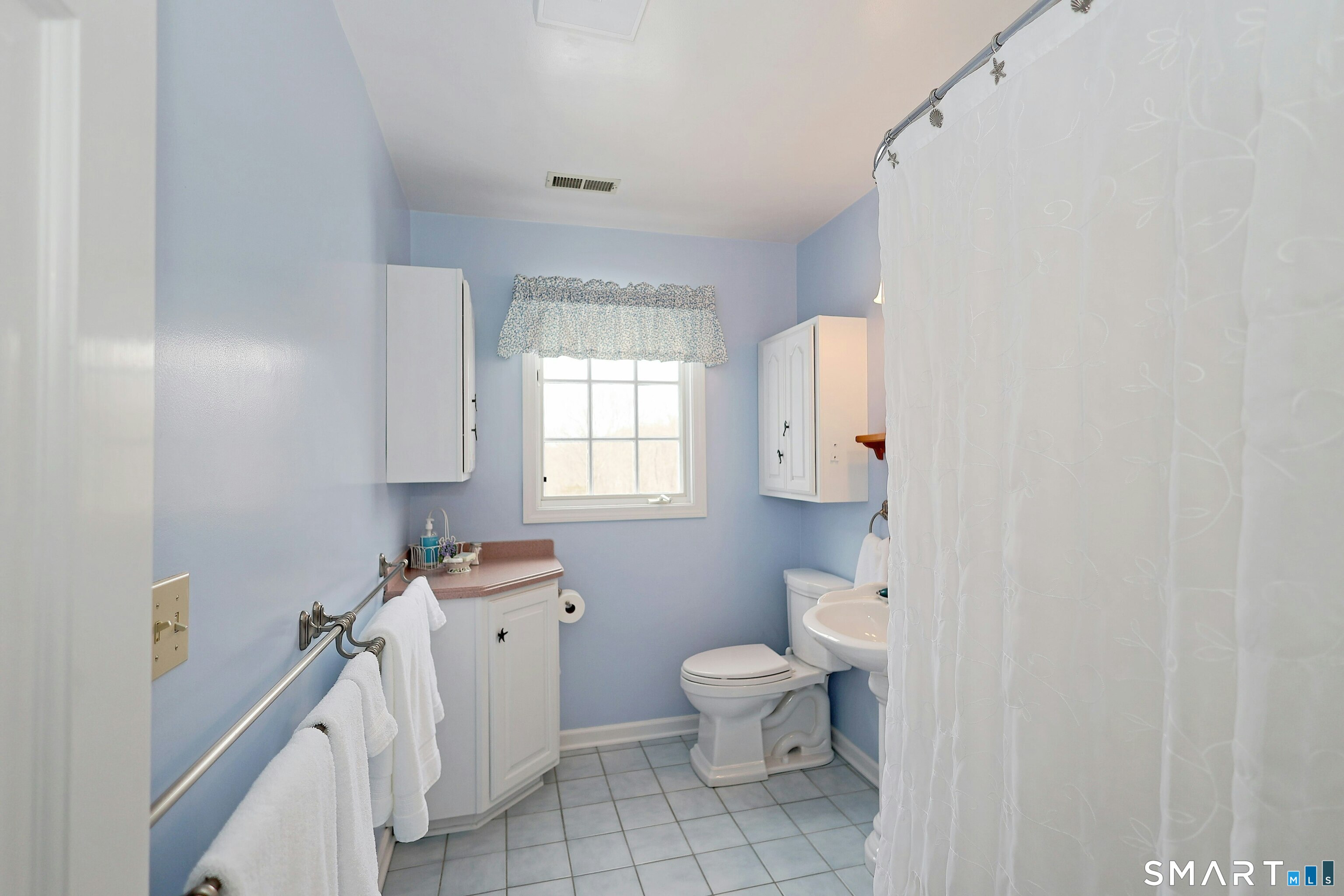 36-40 Fox Run Road Redding, CT 06896 - Photo 27 of 40 a bathroom with a toilet sink and mirror