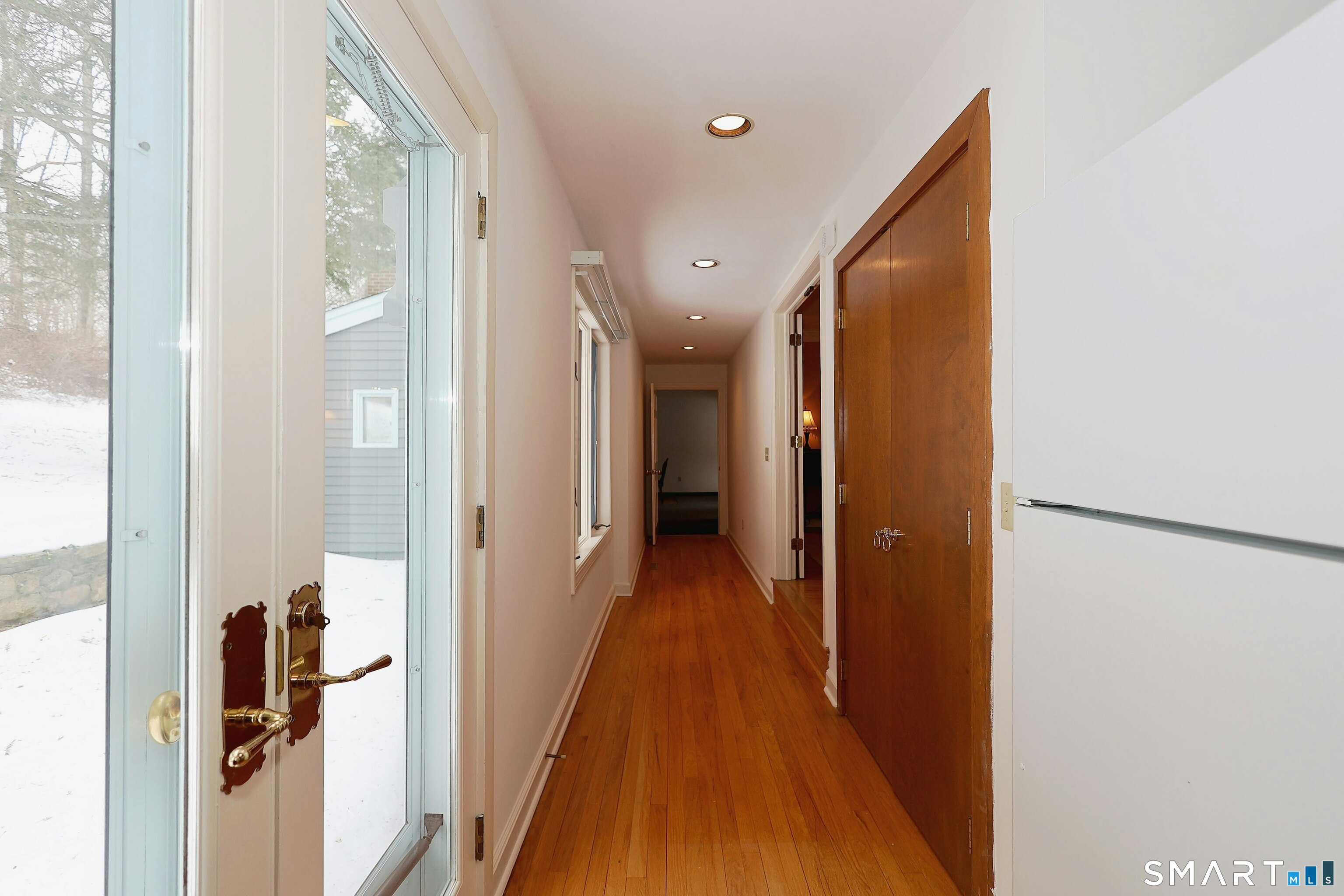36-40 Fox Run Road Redding, CT 06896 - Photo 36 of 40 a view of a hallway with wooden floor and staircase