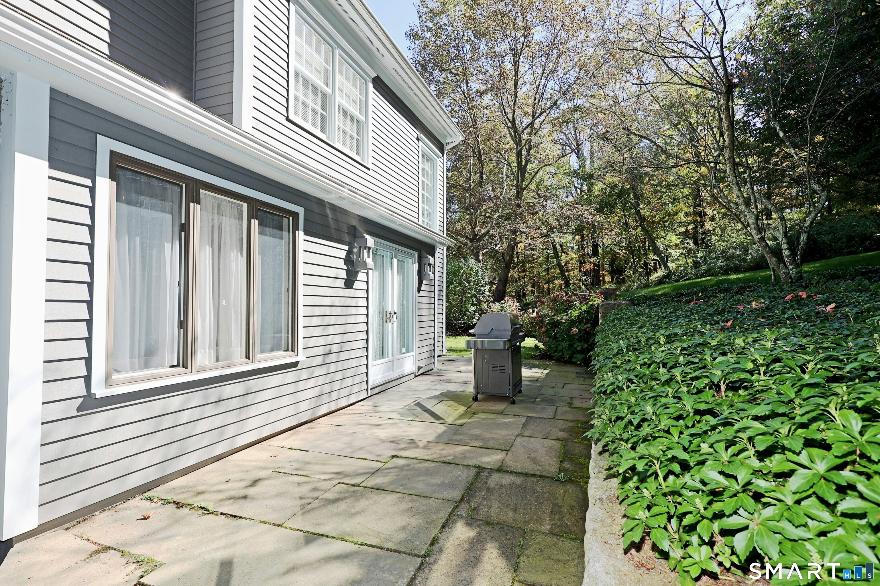 36-40 Fox Run Road Redding, CT 06896 - Photo 37 of 40 a front view of a house with a garden