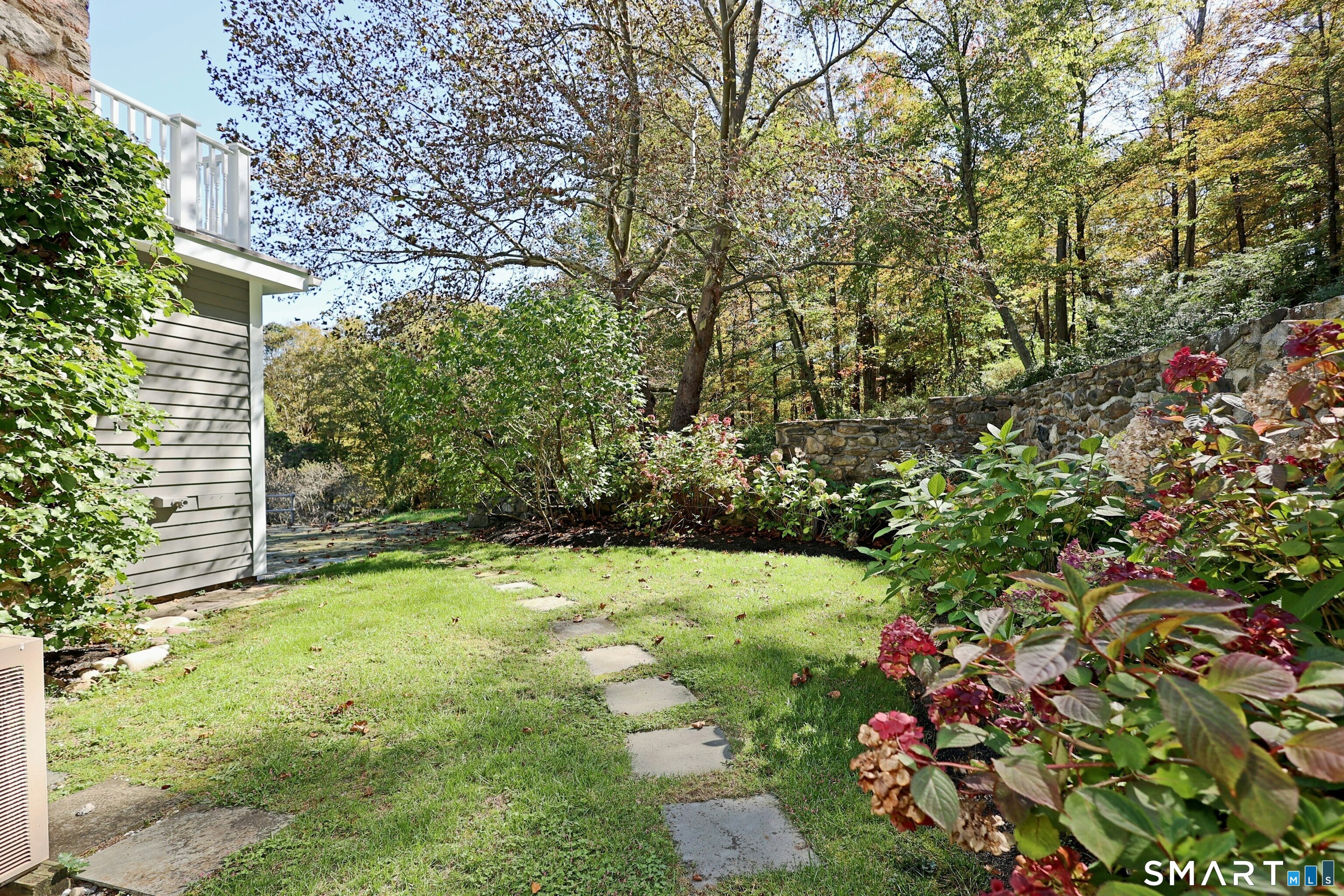 36-40 Fox Run Road Redding, CT 06896 - Photo 38 of 40 a view of backyard with plants and large trees