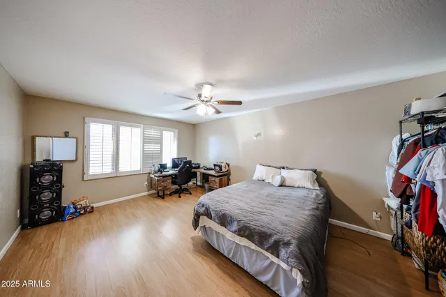 a bed room with bed and a window