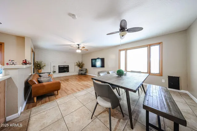 a view of a dining room with furniture and a livingroom