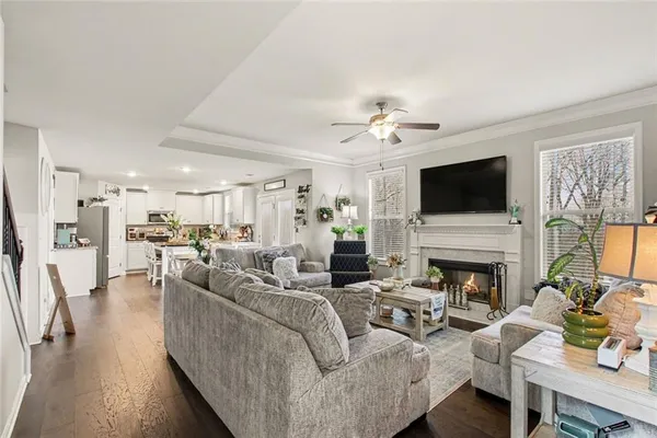 a living room with furniture fireplace and a flat screen tv