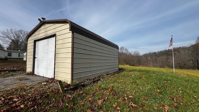 1287 Shaffer Road Ellwood City, PA 16117 - Photo 4 of 11 a view of a backyard with pathway