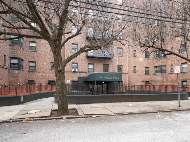 a view of a house with large tree