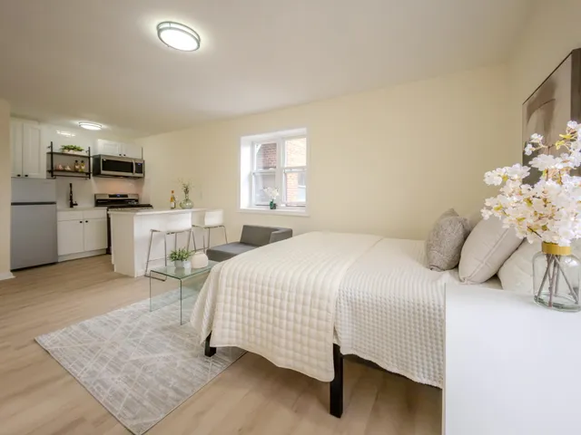 a bedroom with a bed and furniture