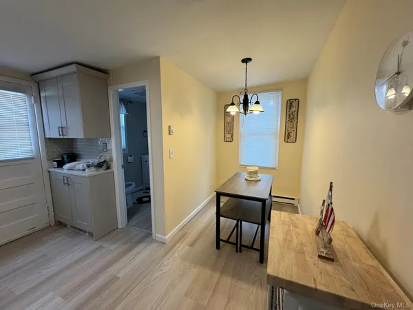 a kitchen that has a table and chairs in it