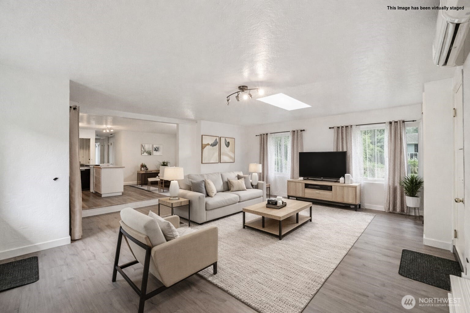 20911 West Richmond Road Bothell, WA 98021 - Photo 11 of 25 a living room with furniture and a flat screen tv