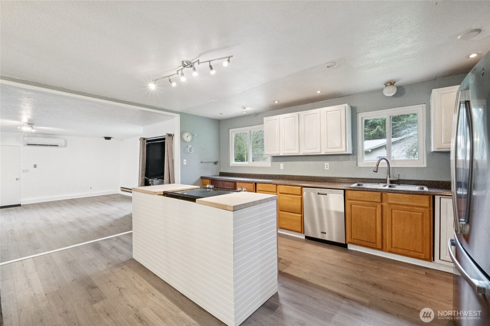 20911 West Richmond Road Bothell, WA 98021 - Photo 12 of 25 a kitchen with stainless steel appliances granite countertop a sink and cabinets