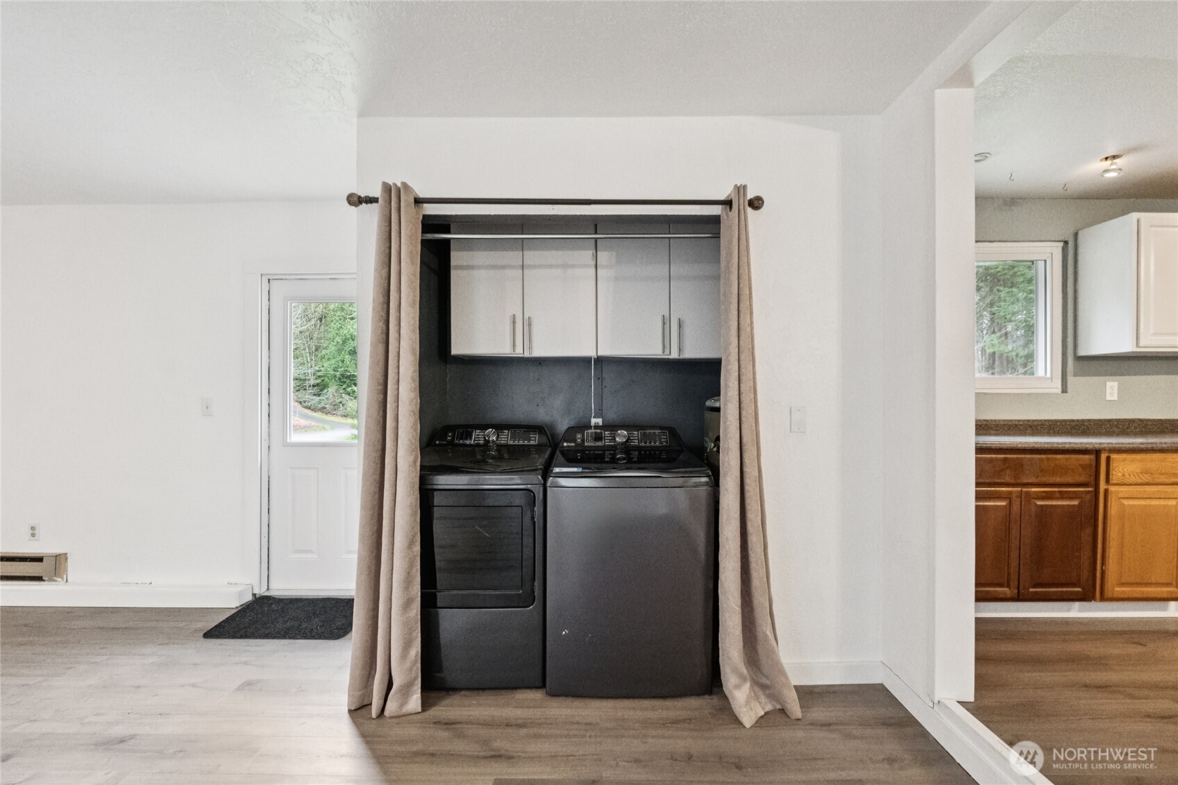 20911 West Richmond Road Bothell, WA 98021 - Photo 15 of 25 a kitchen with stainless steel appliances a refrigerator and a stove top oven