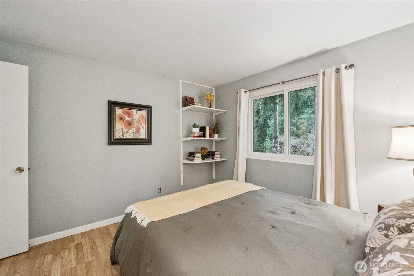 20911 West Richmond Road Bothell, WA 98021 - Photo 18 of 25 a bedroom with a bed and a window