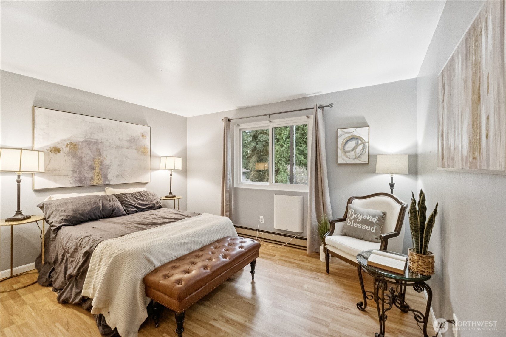 20911 West Richmond Road Bothell, WA 98021 - Photo 19 of 25 a bedroom with a bed and wooden floor