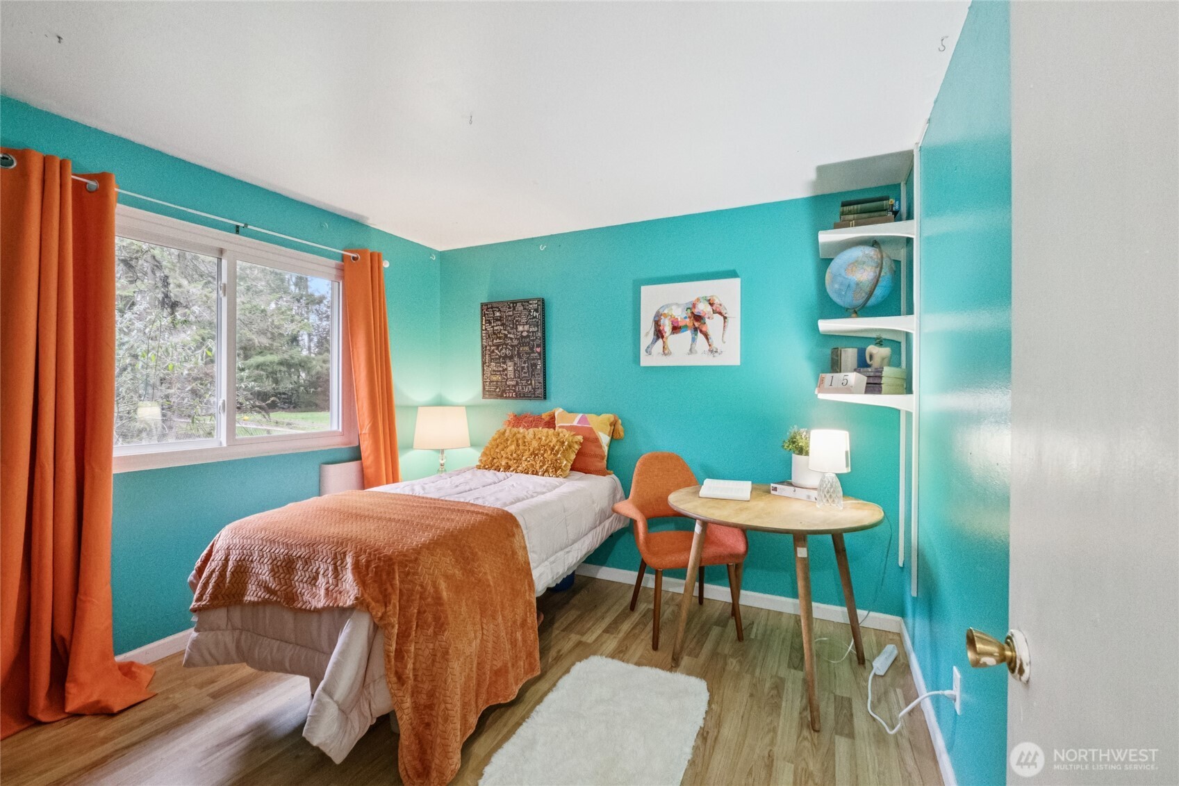 20911 West Richmond Road Bothell, WA 98021 - Photo 21 of 25 a bedroom with a bed and a bookshelf