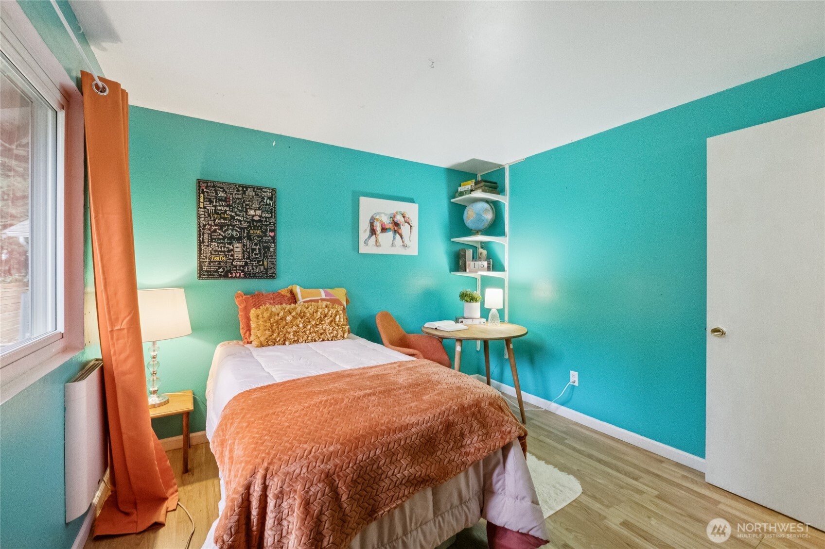 20911 West Richmond Road Bothell, WA 98021 - Photo 22 of 25 a bed sitting in a bedroom next to a window