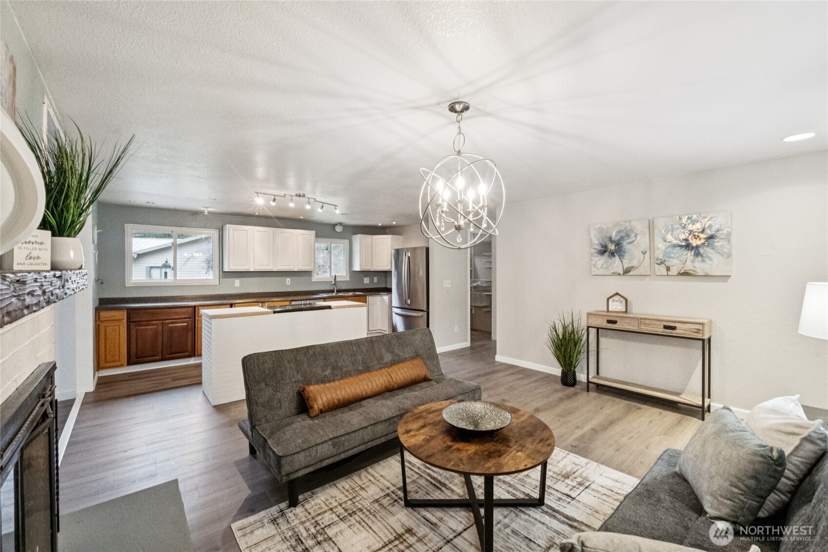 20911 West Richmond Road Bothell, WA 98021 - Photo 7 of 25 a living room with furniture and kitchen view
