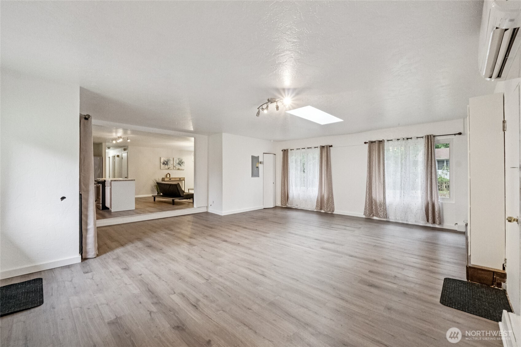20911 West Richmond Road Bothell, WA 98021 - Photo 10 of 25 a view of livingroom with furniture and wooden floor
