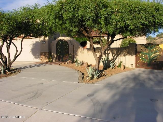 407 Camino Osito Rio Rico, AZ 85648 - Photo 1 of 23 a view of a street with a tree