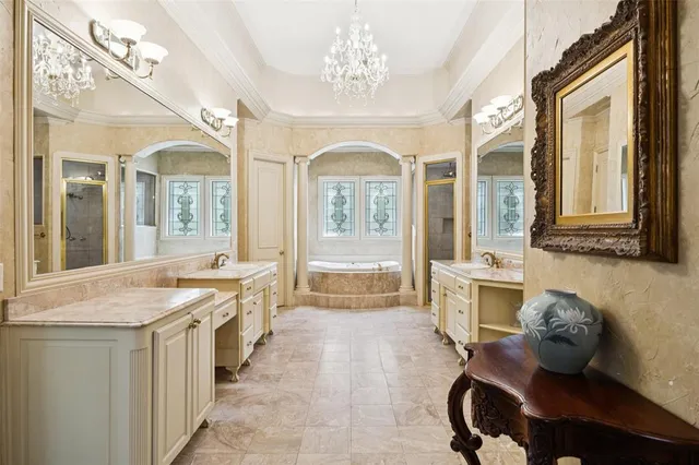 a spacious bathroom with a granite countertop sink mirror and a bath tub
