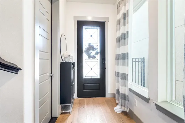 a view of a bathroom from a hallway