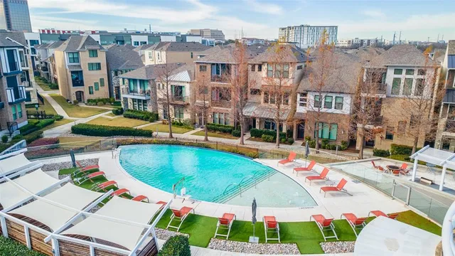 a view of a swimming pool with a lounge chairs