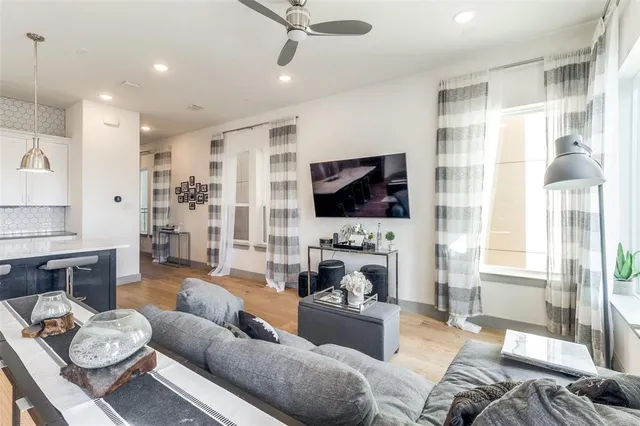 a living room with furniture fireplace and a flat screen tv