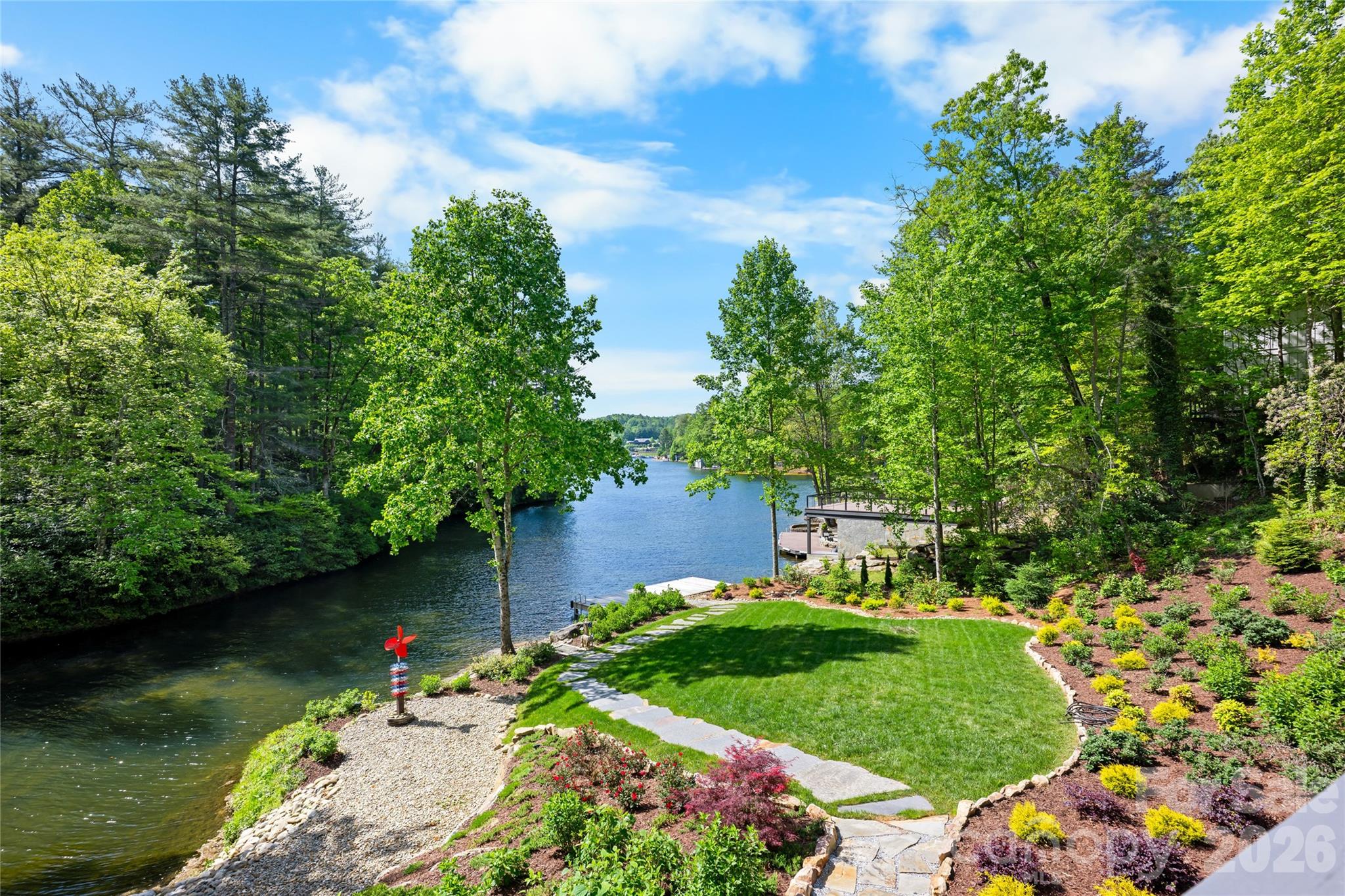 2235 Cold Mountain Road Lake Toxaway, NC 28747 - Photo 26 of 47 a view of a garden with a lake