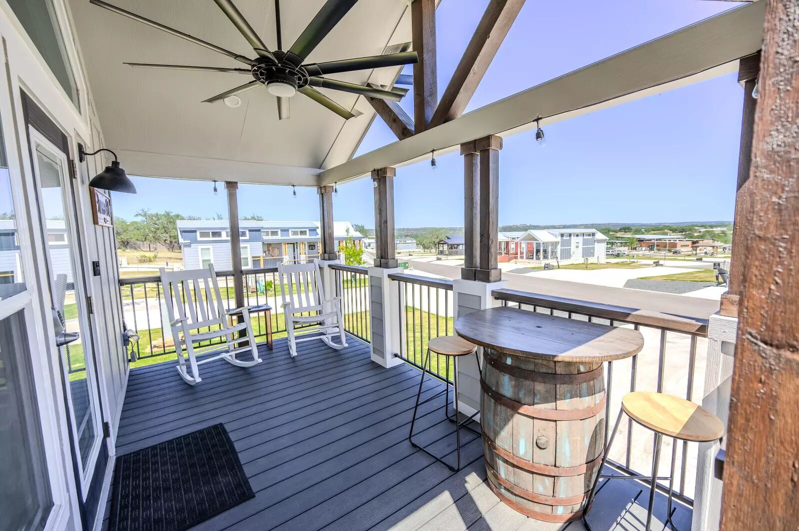 5386 Ranch Road 1376, Unit 79 Fredericksburg, TX 78624 - Photo 4 of 39 Wooden deck with a residential view and ceiling fan