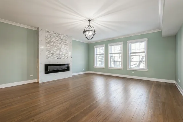 a room with a bed and wooden floor