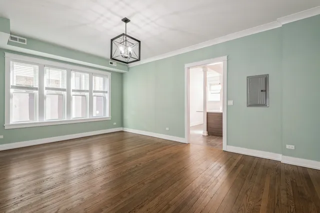 a stove top oven sitting inside of a kitchen