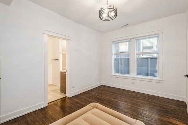 a bathroom with a shower a toilet and a shower